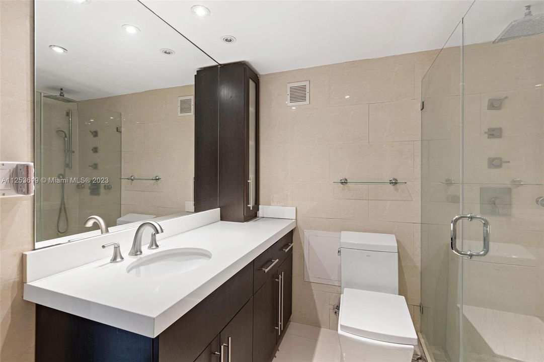 Fully renovated master bathroom with large rainfall shower.Unit #721, 1200 West Avenue, Miami Beach.