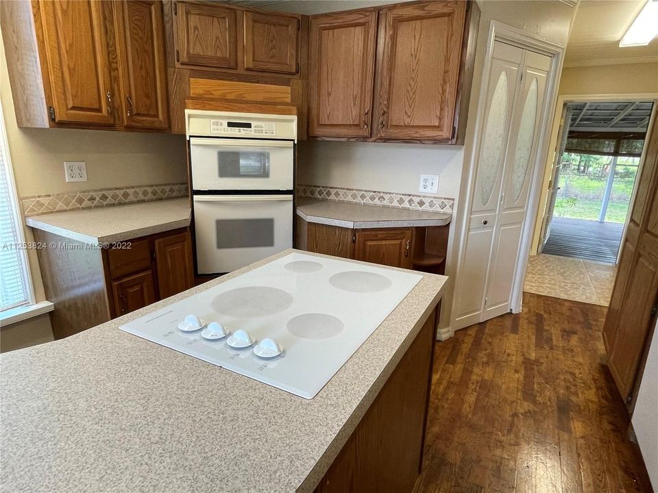 kitchen flows through to the screened patio.