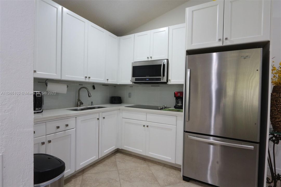 Kitchen with Remodeled cabinets and Stainless Steel Full Size Fridge