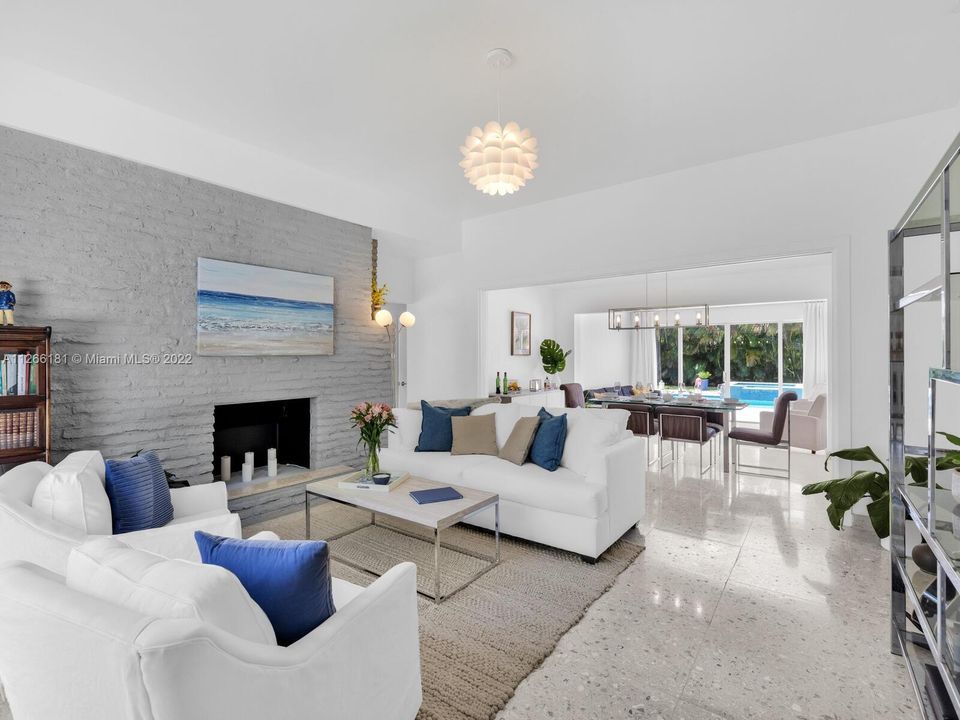 Open-flow floor plan with gorgeous sea stone floors.