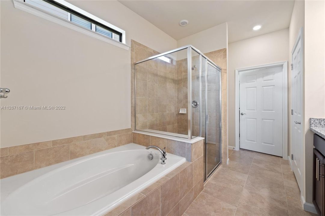 Owner's suite separate soaking tub and shower