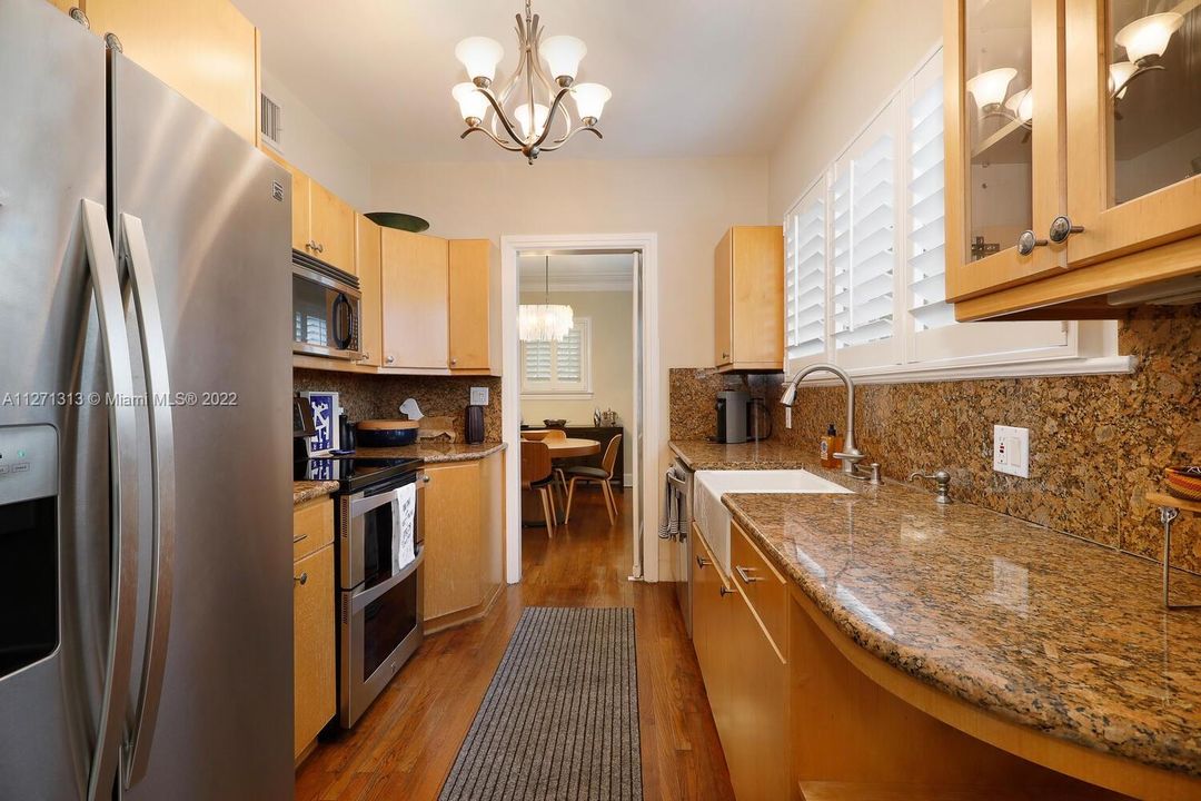 Upgraded galley kitchen with stainless steel appliances and plenty of cabinets!