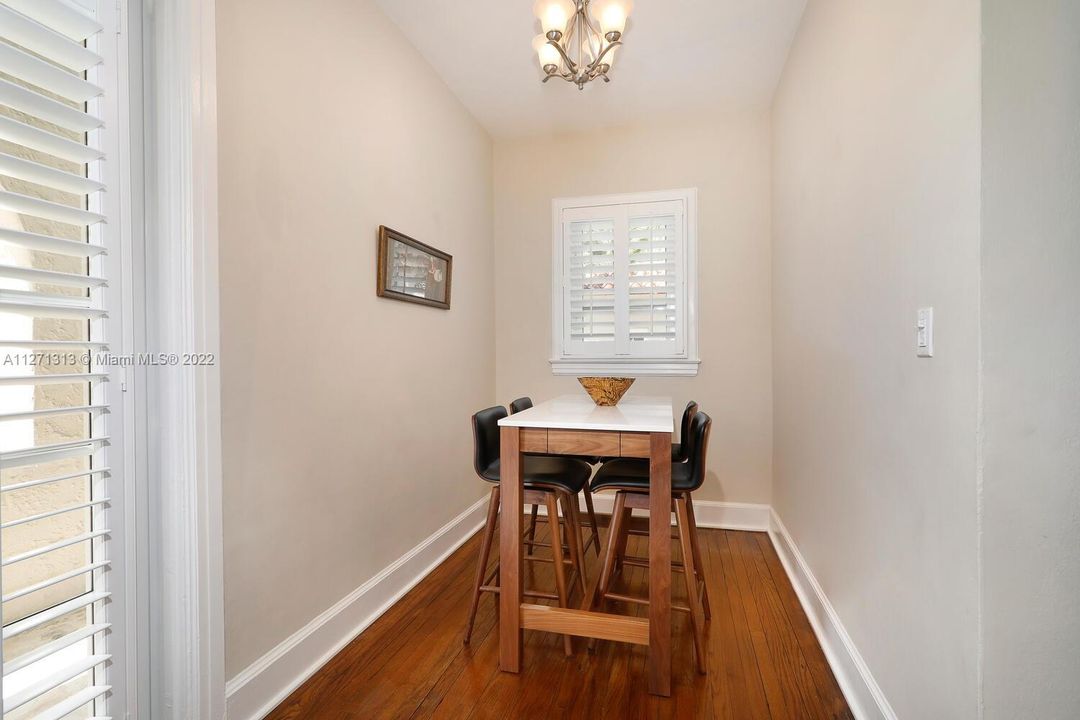 Adjoining breakfast room is super chic! Access to side porch and garage.