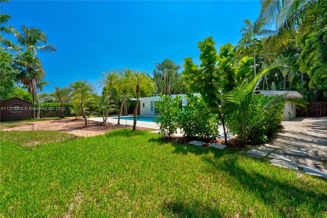 Privacy offered by Oversize 12,000 SF fenced, landscaped lot with large 18' x 36' pool (depth 3 to 6 ')