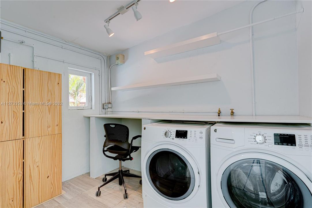 Laundry Room- roomy with window  with folding area and storage closet