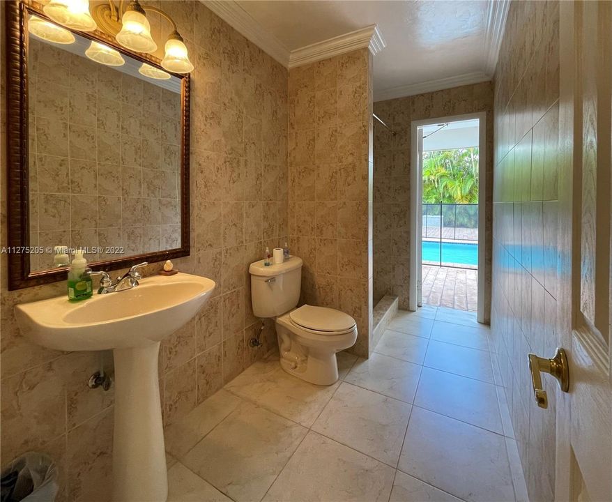 2nd Full Bathroom and with access to/from the Pool for convenience when entertaining in the Pool area