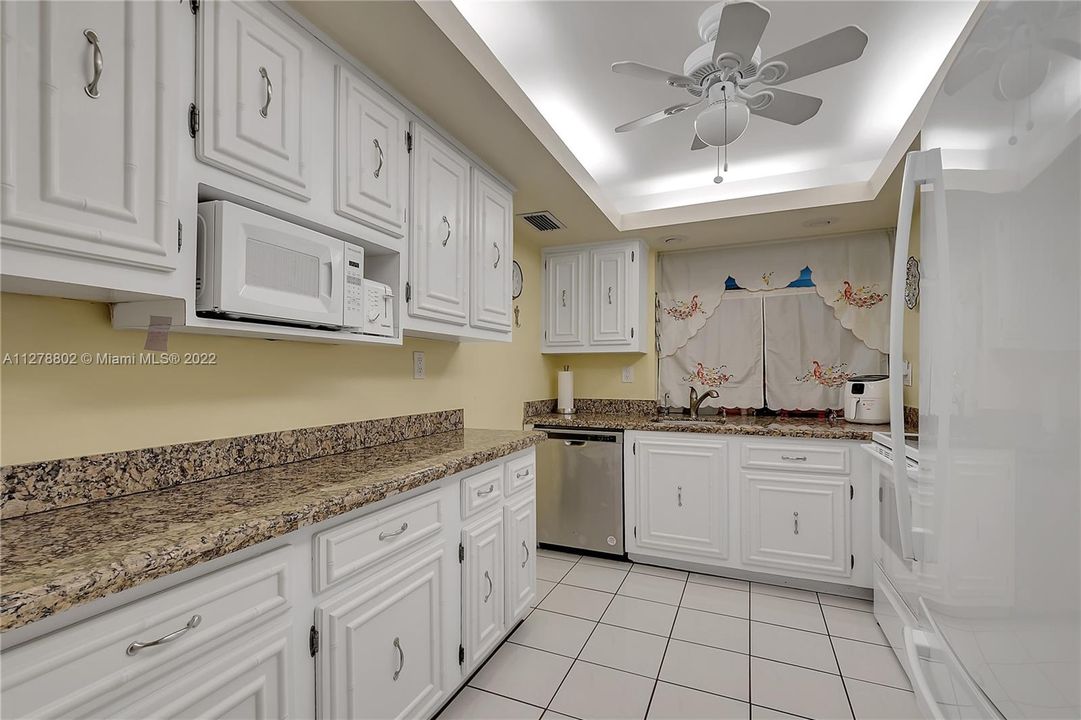 Spacious kitchen with ample counter space for you to prepare your meals