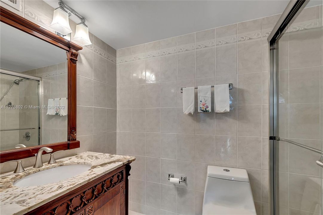 Master bathroom with shower has a spacious vanity for storage