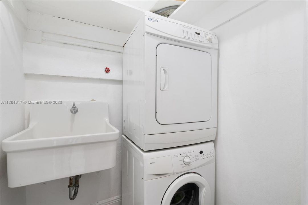 Laundry room with sink, inside condo