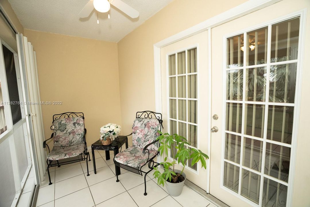 Screened in porch with French doors to living room.   Accordion shutters are installed.