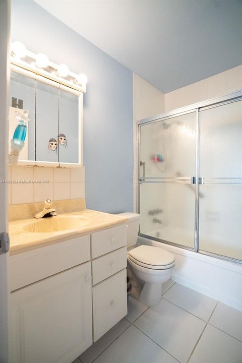 Master bedroom bathroom.  Tub/shower with safety rails.
