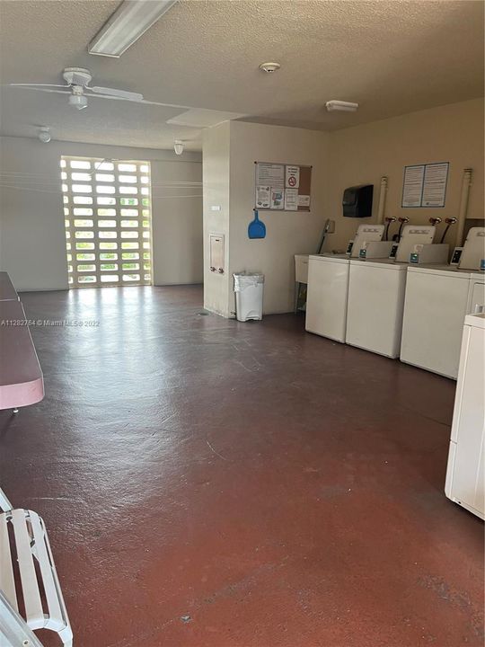 You will love this laundry room.  So open and airy, also facing interior pool area. 2nd floor next to elevator