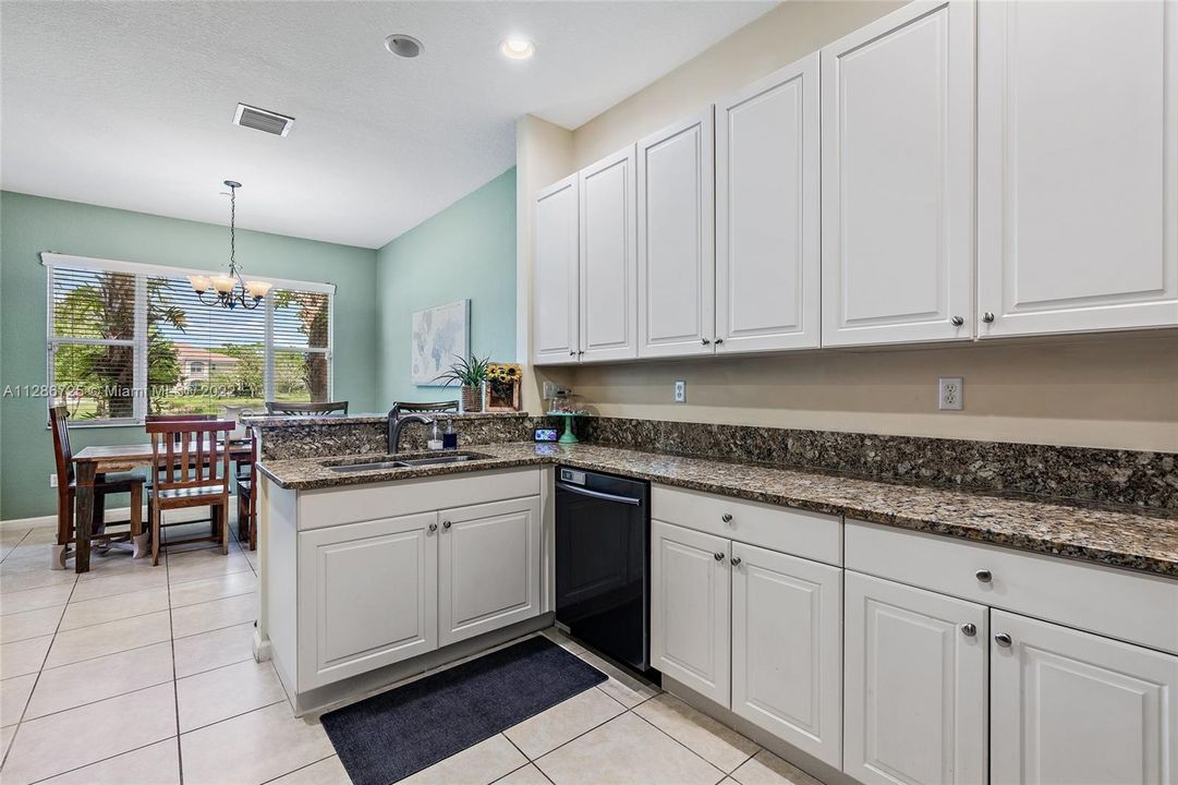 The kitchen has a view of Whitemarsh Pond