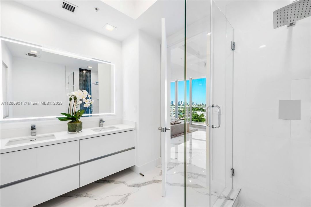 En Suite Full Bath with Dual Sinks & Backlit Mirror
