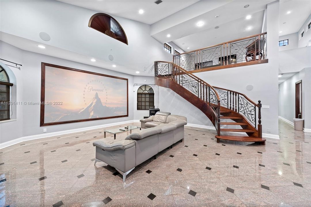 Winding staircase leading to loft of home