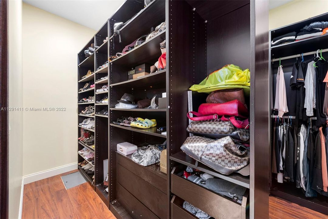 1 of 2 walking master bedroom closets with Floor to ceiling closet units