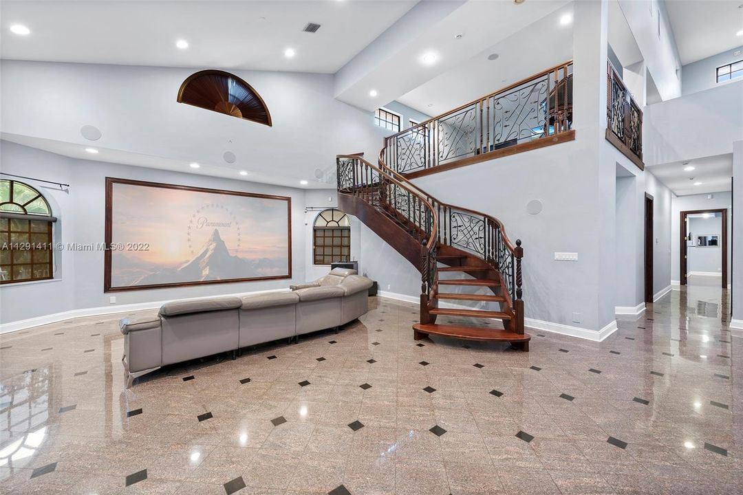 Family room boast 25 feet ceilings.