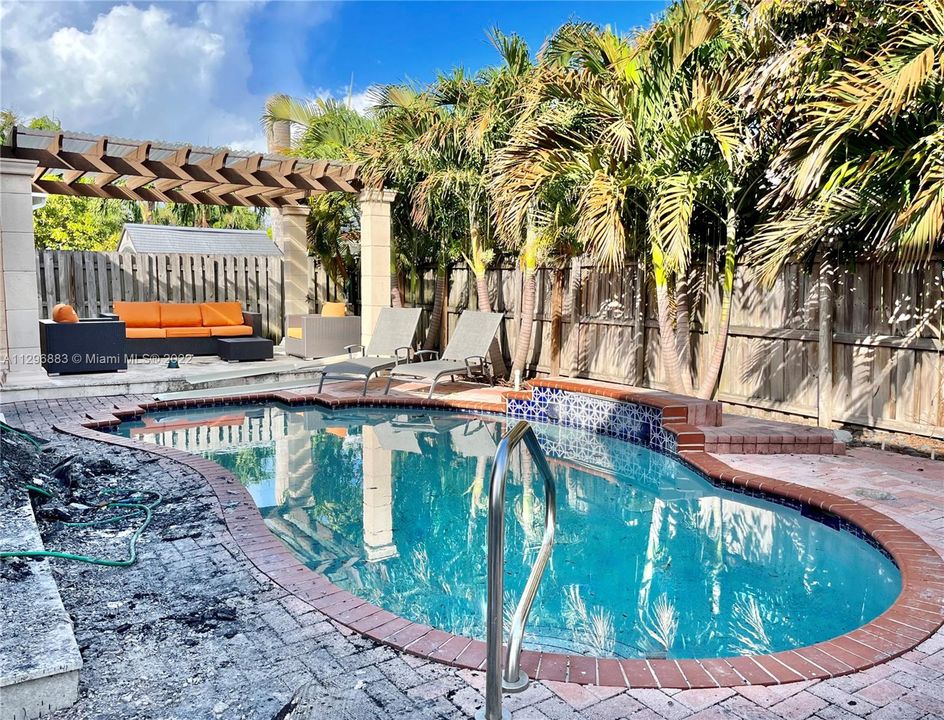 backyard with undamaged pool