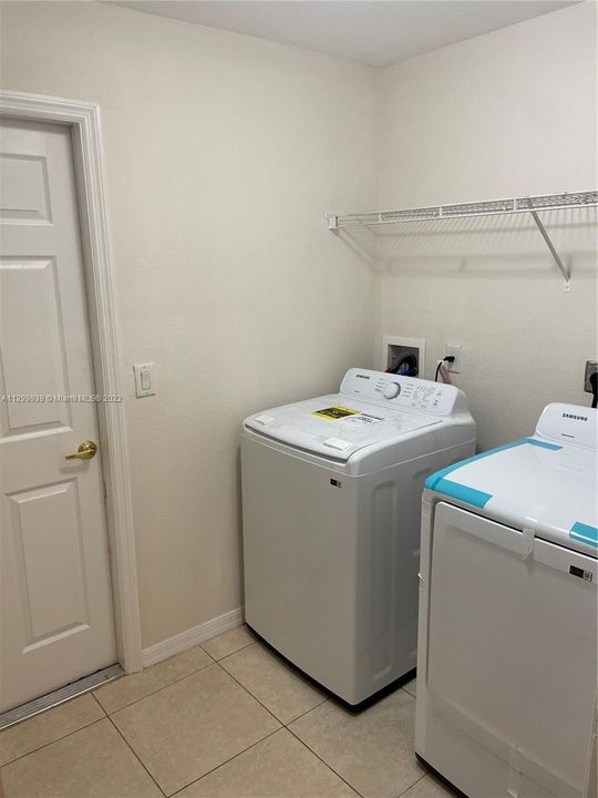 laundry room off kitchen to garage with new washer/dryer