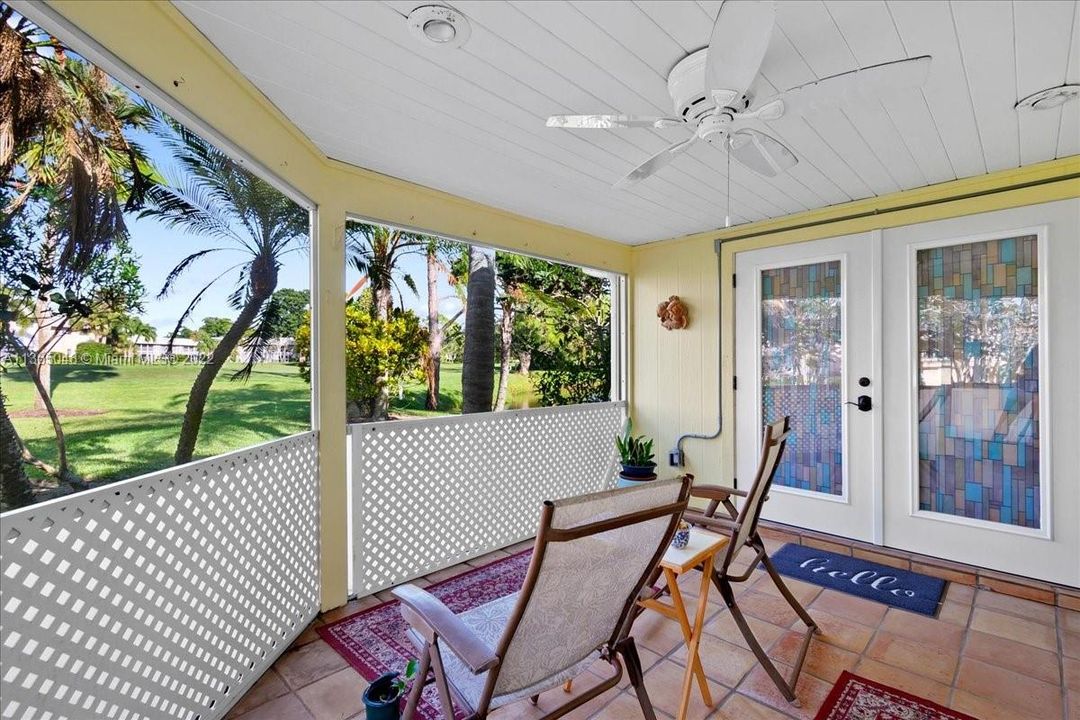 Large screen patio off the sunroom and office ,overlooks the golf course