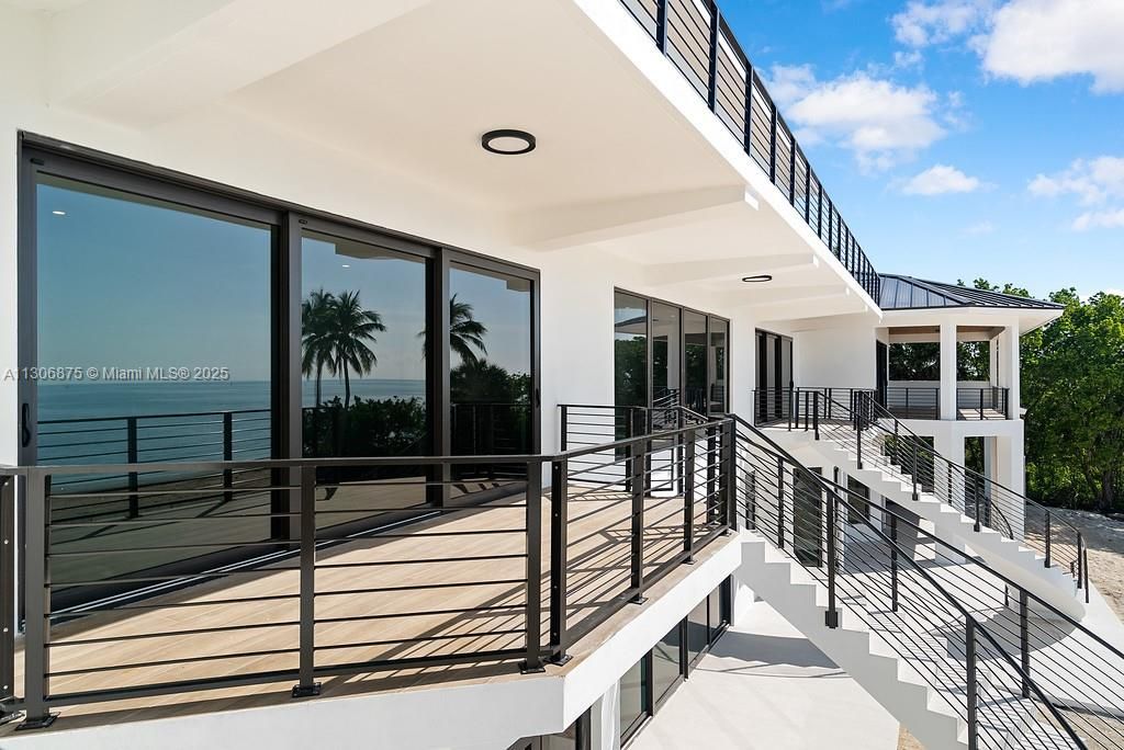 Mirrored Staircases from 2nd Floor to Pool Area