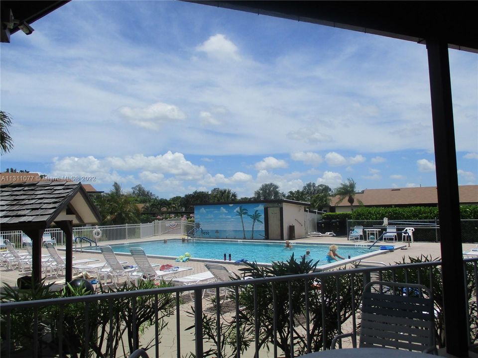 OVERSIZED POOL AREA WITH MURAL OF OCEAN