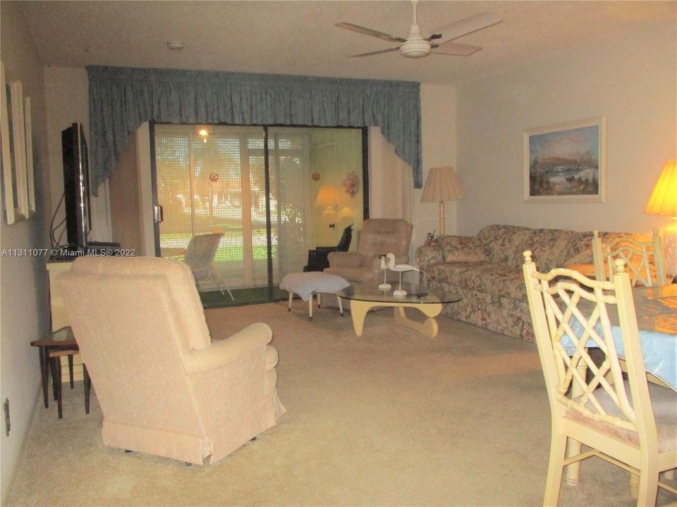 OPEN CONCEPT LIVING  & DINING AREA OUT TO THE PATIO