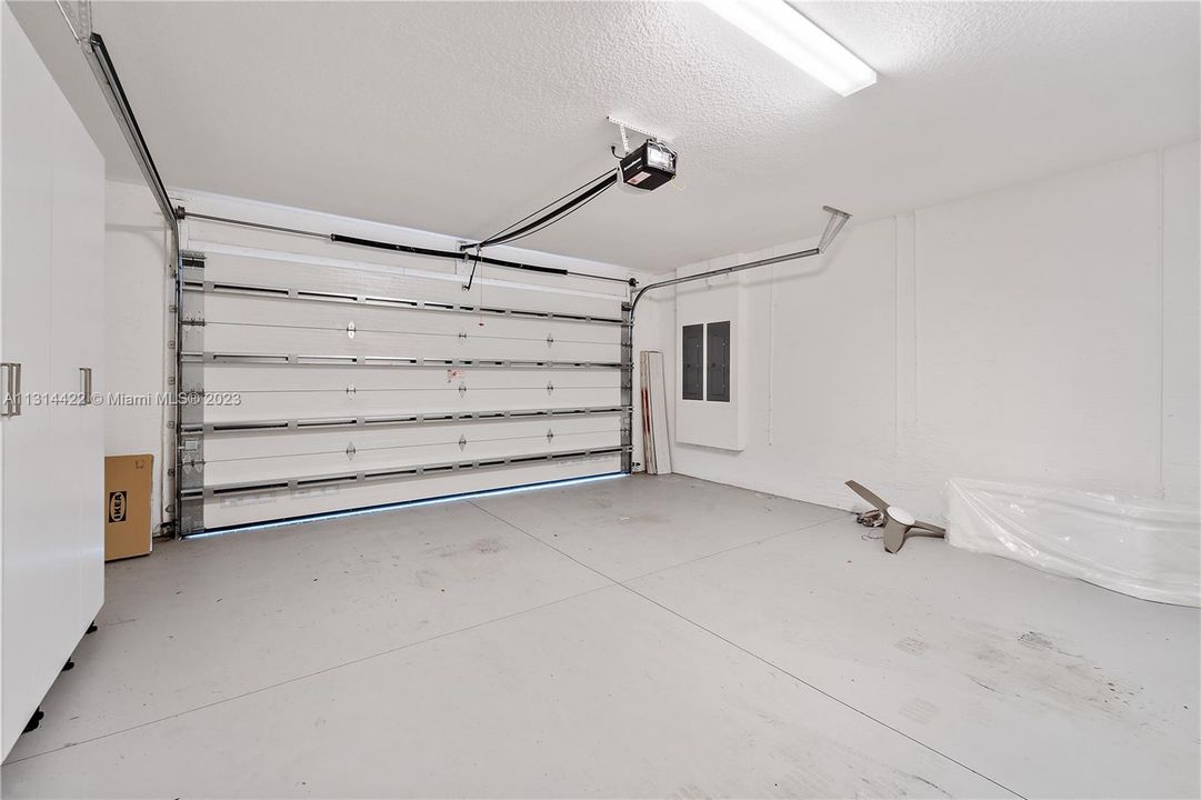 2 car garage with storage cabinets