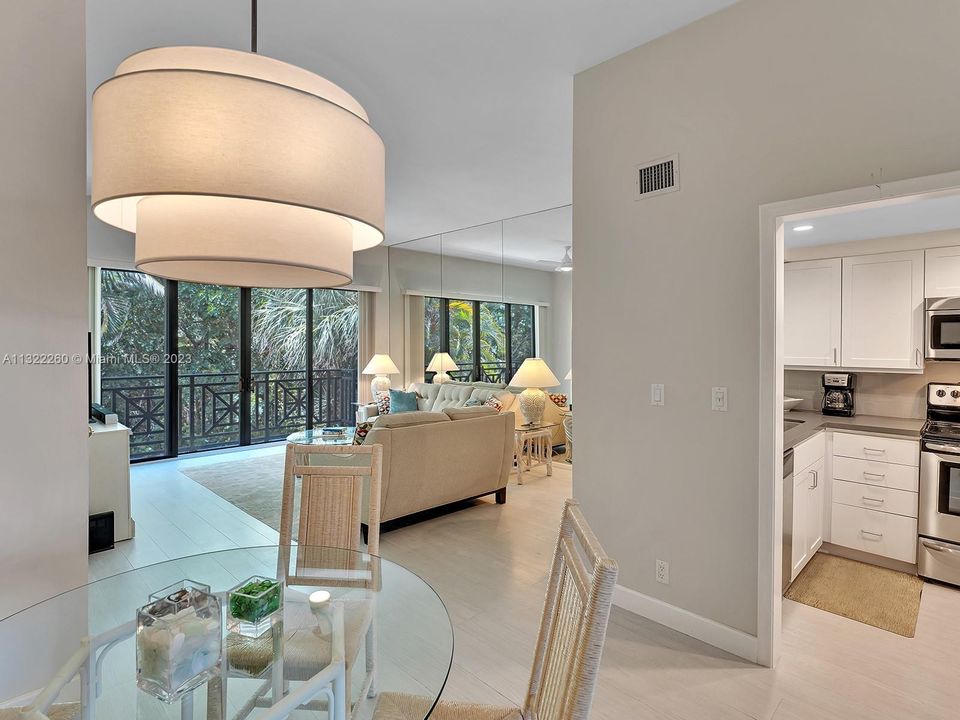 dining area with view to kitchen and family room