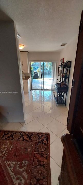 sliding door to back travertine patio and laundry room