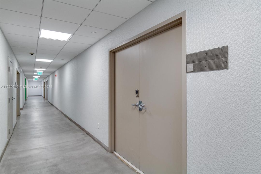 Interior Hallway and front door entrance view to Suite