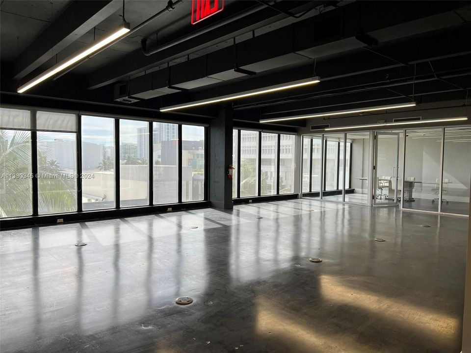 Open "pit" cubicles area with Lincoln Road Views.  Office features 4 to 5 office and conference room.