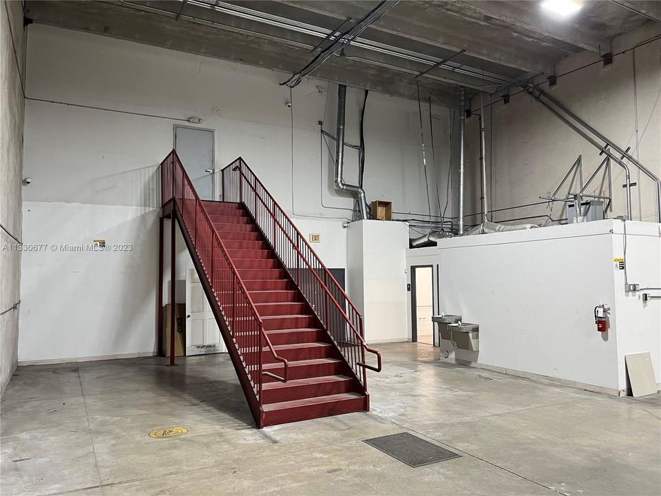 warehouse space. Stairs to mezzanine