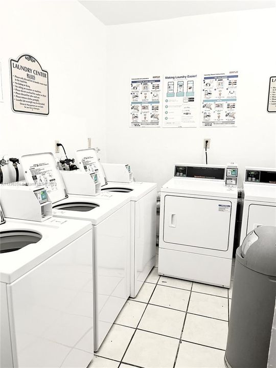 Common Laundry room area with 3 commercial full size washing machines and 3 commercial oversized dryer machines control and paid for with telephone app