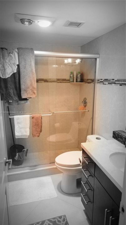 stall shower and very roomy bathroom