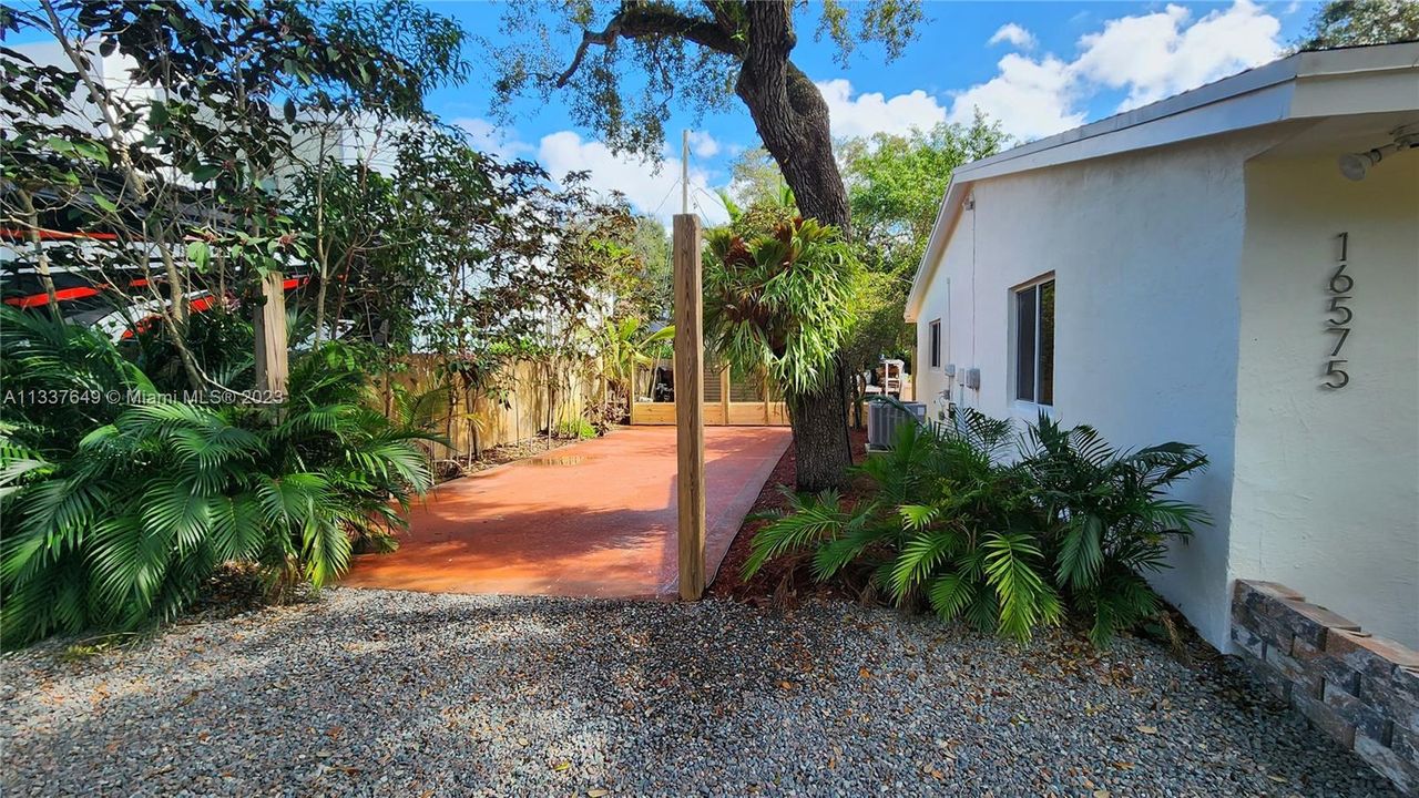 View of side of the property; also parking area for tenants and their guests.