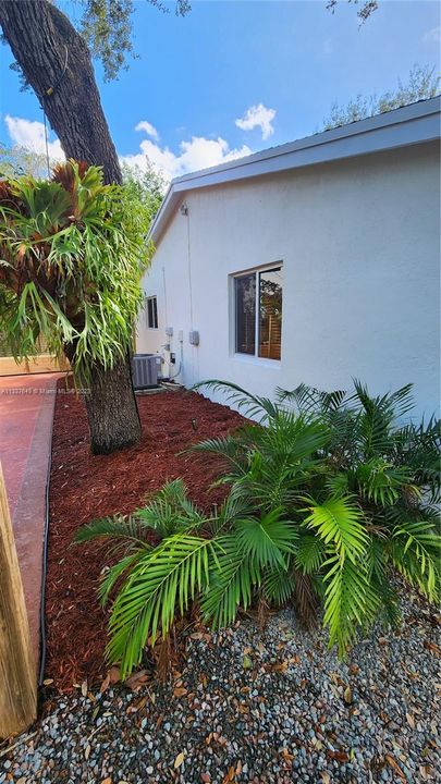 Area where barbeque and small patio furniture can be placed on this side of the home on the mulch area