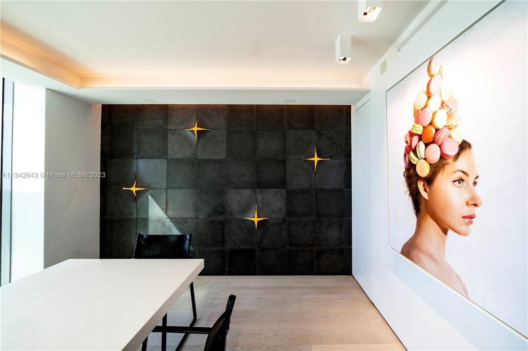Stunning expertly lit cement wall by Ann Sacks!
