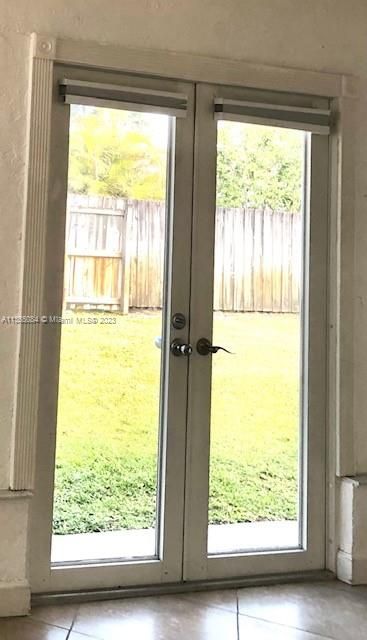 French doors leading to Back Yard from Florida Room