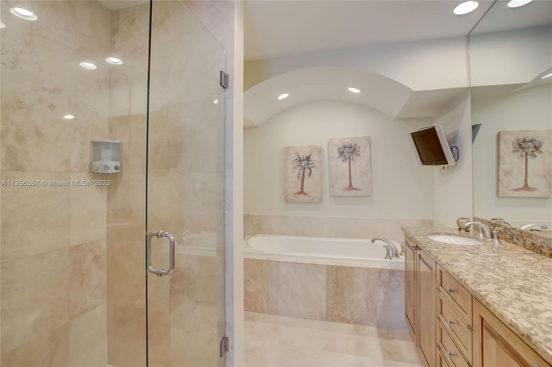 Frameless shower door, beautiful marble flooring