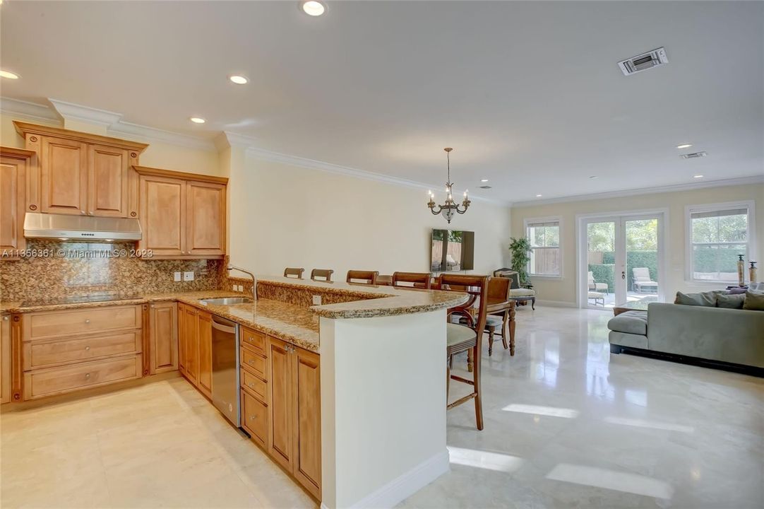 Large kitchen w/ breakfast counter, open concept to dining and family / great room.