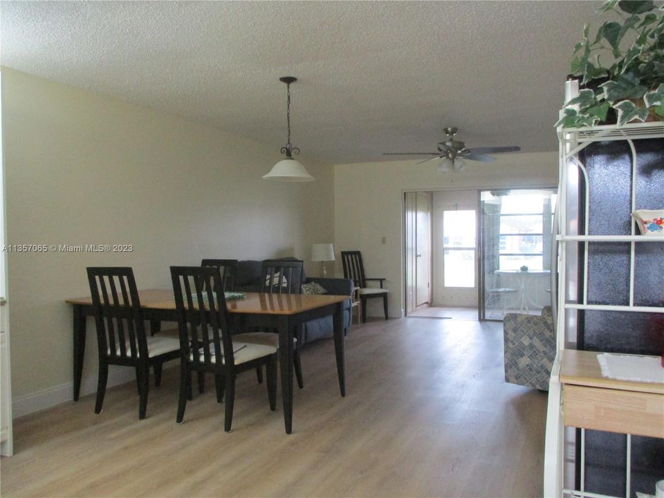As you enter the villa the view of kitchen, living & dining area.