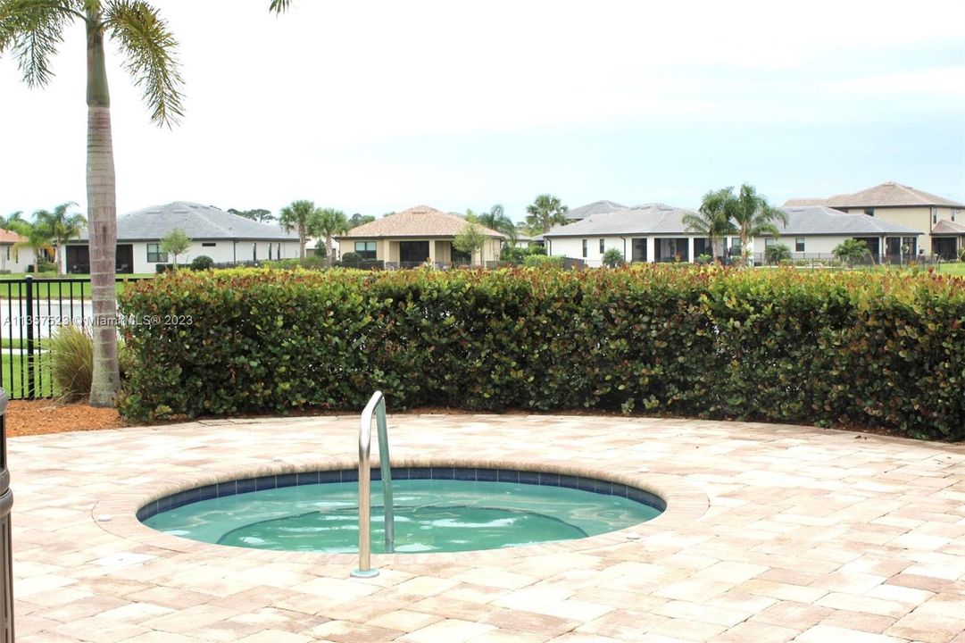 Large Resort Style Pool with Lounge Chairs and Cabanas