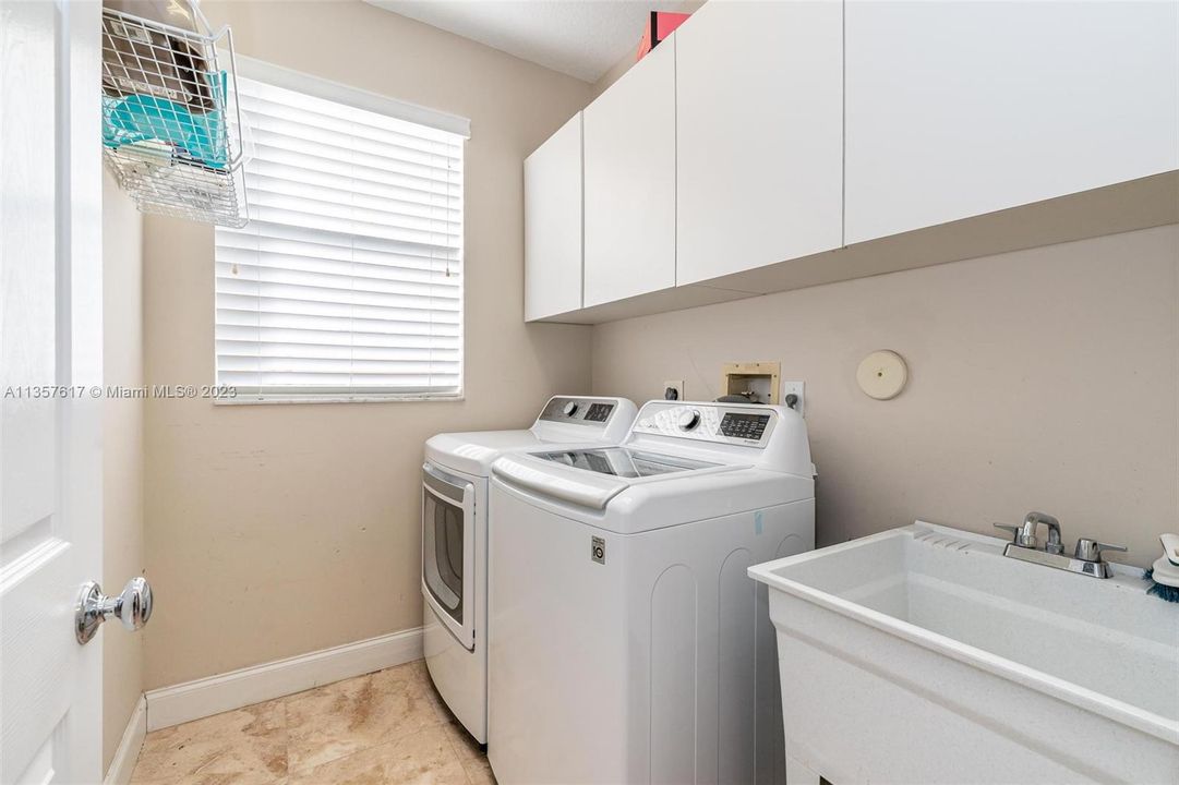 Laundry has sink and window.