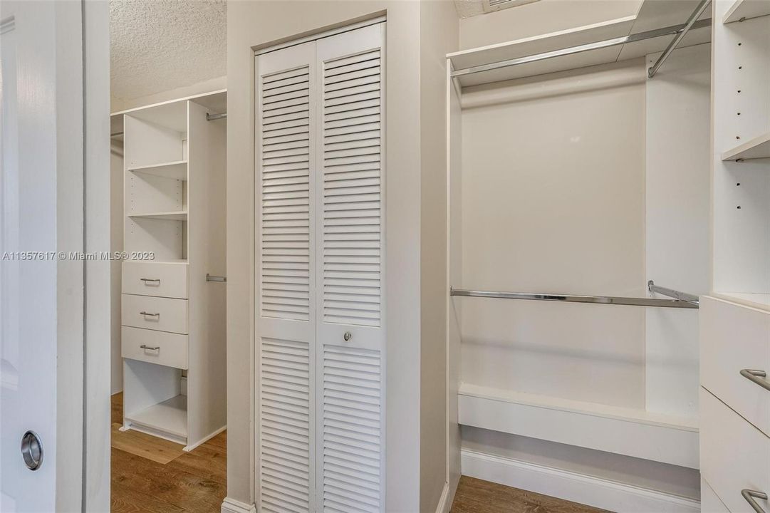 The walk-in closet is already built and comes with ample space, drawers, and hangers.