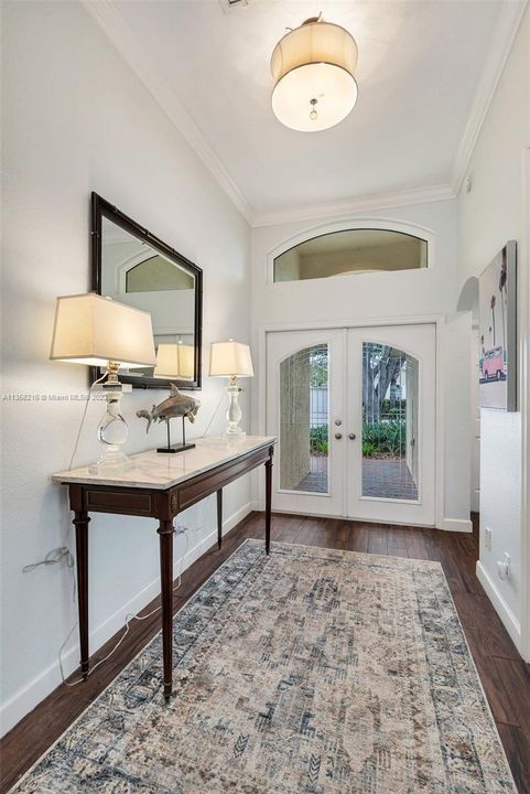 Beautiful entryway with beveled glass doors.