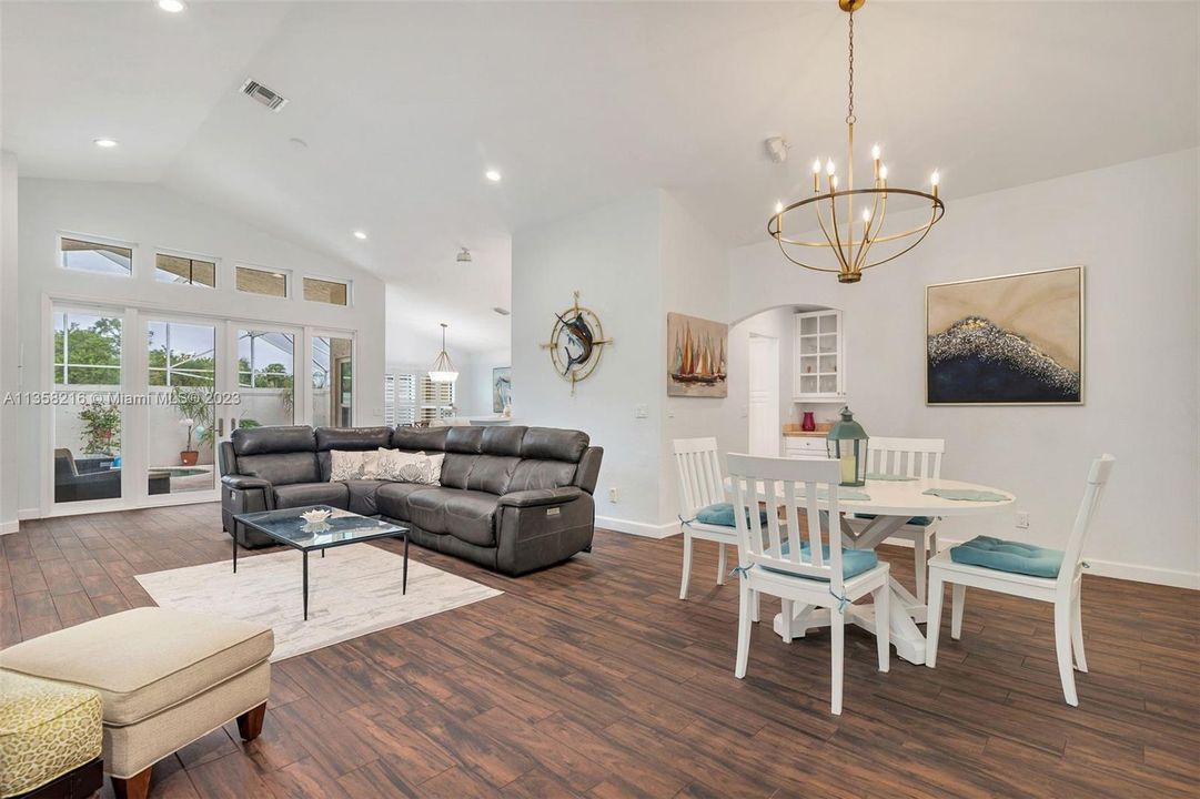 Open floor plan with gorgeous wood plank tile flooring throughout