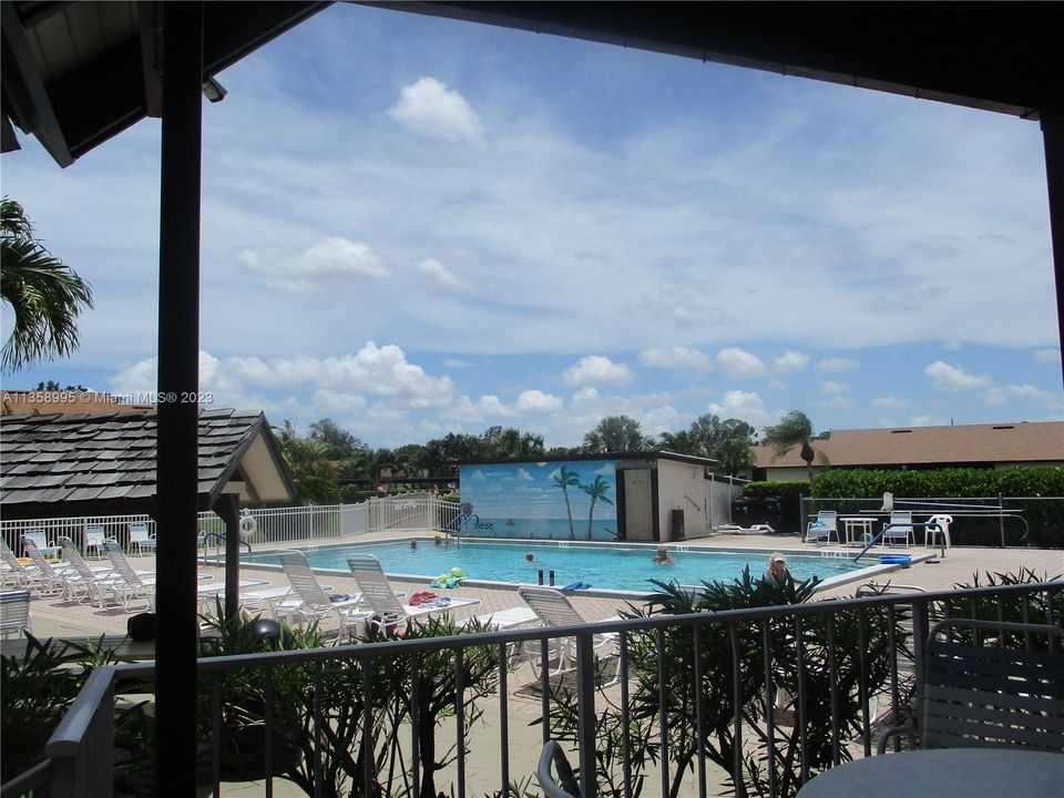 OVER SIZED POOL WITH MURAL OF AN OCEAN VIEW