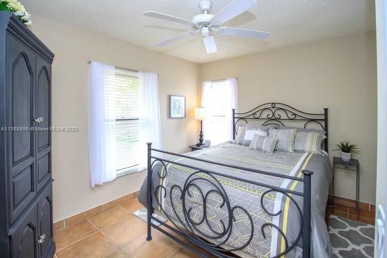GUEST BEDROOM WITH TWO WINDOWS TO BRIGHTEN THE ROOM