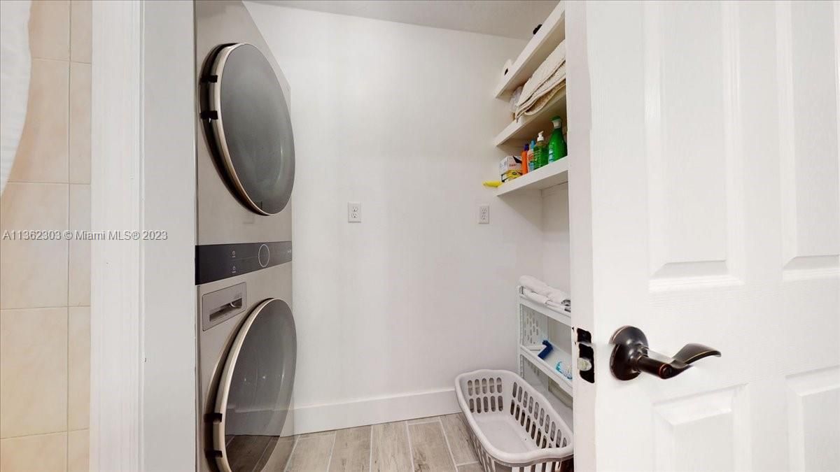 Tile-plank floors, storage and LG Front Loader washer and dryer